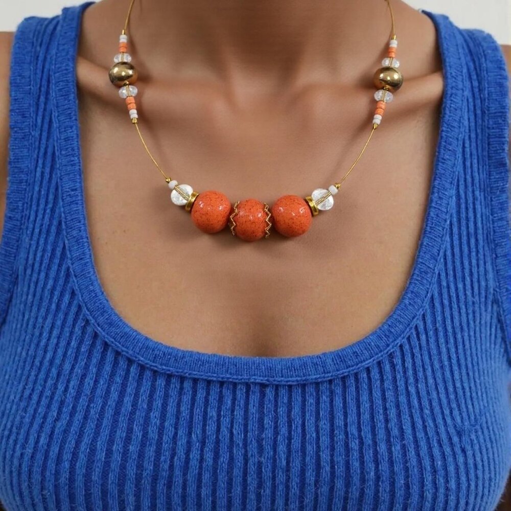 Tropical vibes. Simple orange Bead floating choker with crystal and gold accents